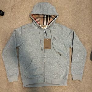 Grey Burberry zip up hoodie with Burberry check pattern.